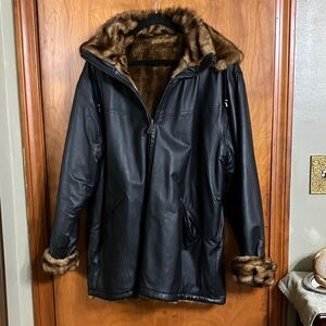 Woman black, genuine, leather coat with faux fur excellent condition